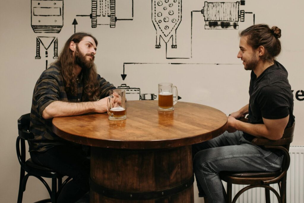 two men talking in the bar