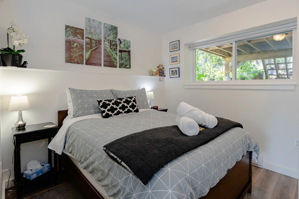 Guest bedroom featuring a queen size bed inside Nanaimo Garden Suite